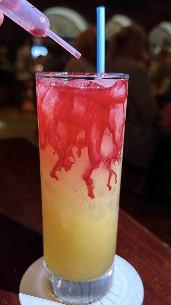 The Alleycat Halloween cocktail with a red beet juice float at The Edison, Disney Springs, $19