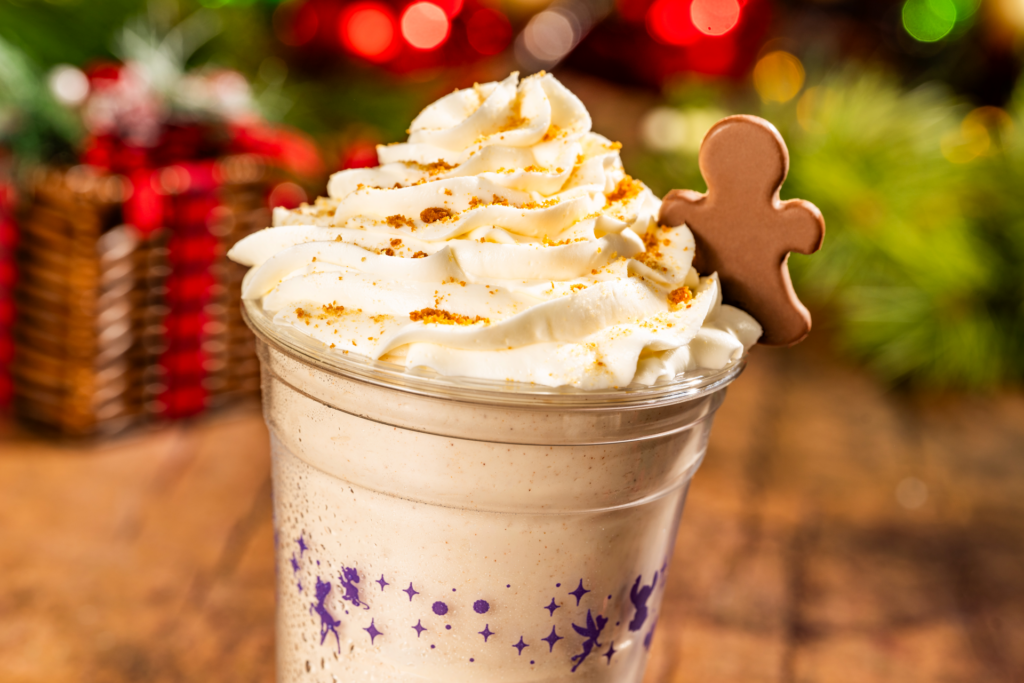 Holiday milkshake topped with whipped cream and a gingerbread man at Magic Kingdom Park