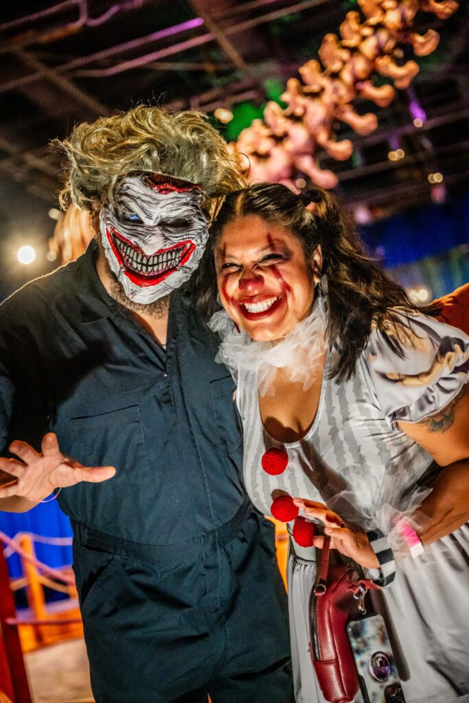 Two guests in creepy clown costumes at OSC After Dark, Orlando Science Center