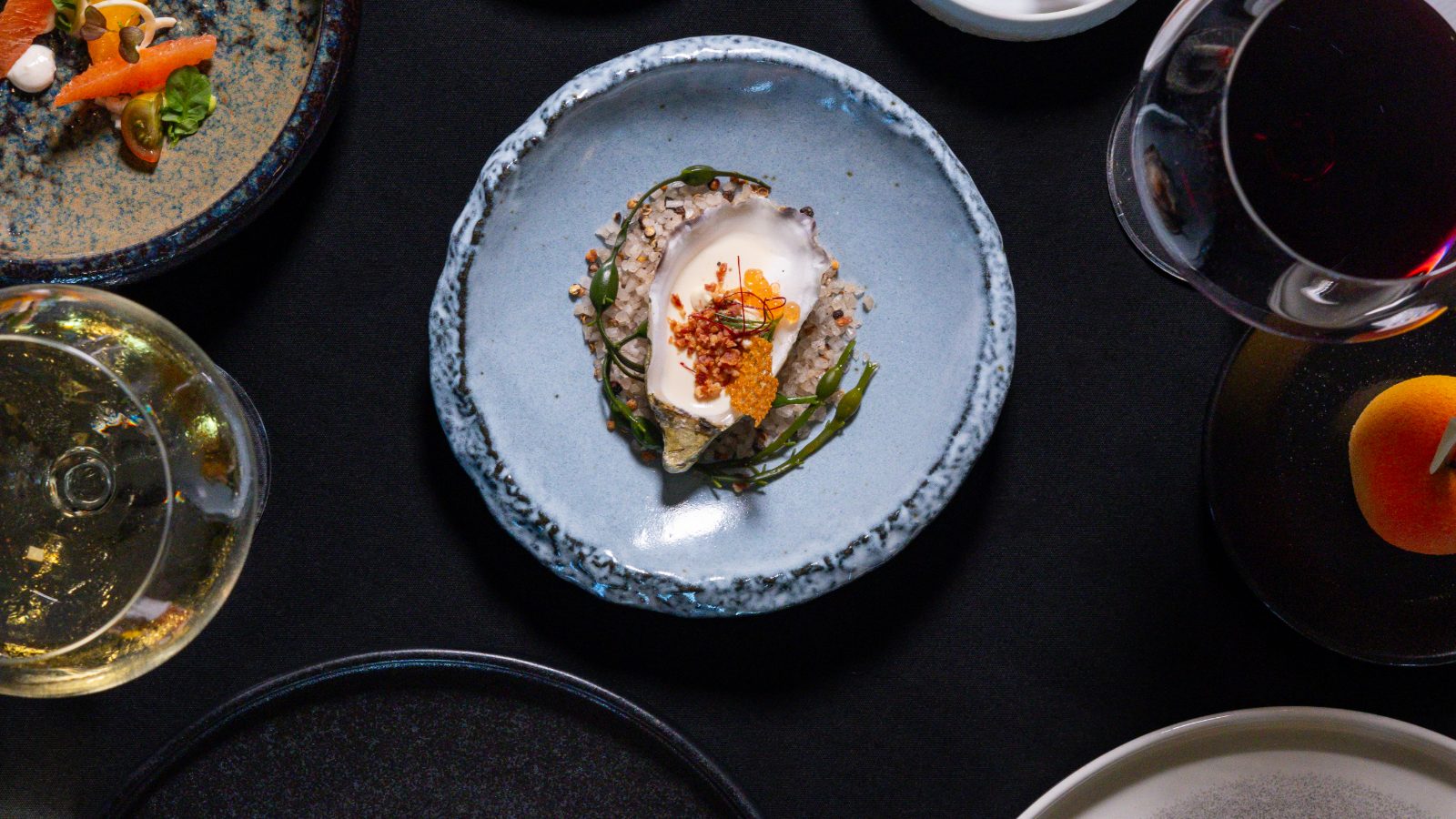 Swan and Dolphin Food and Wine Classic 2026 menu: Oyster Espuma from Todd English’s bluezoo among tasting plates and wine at the Walt Disney World Swan and Dolphin